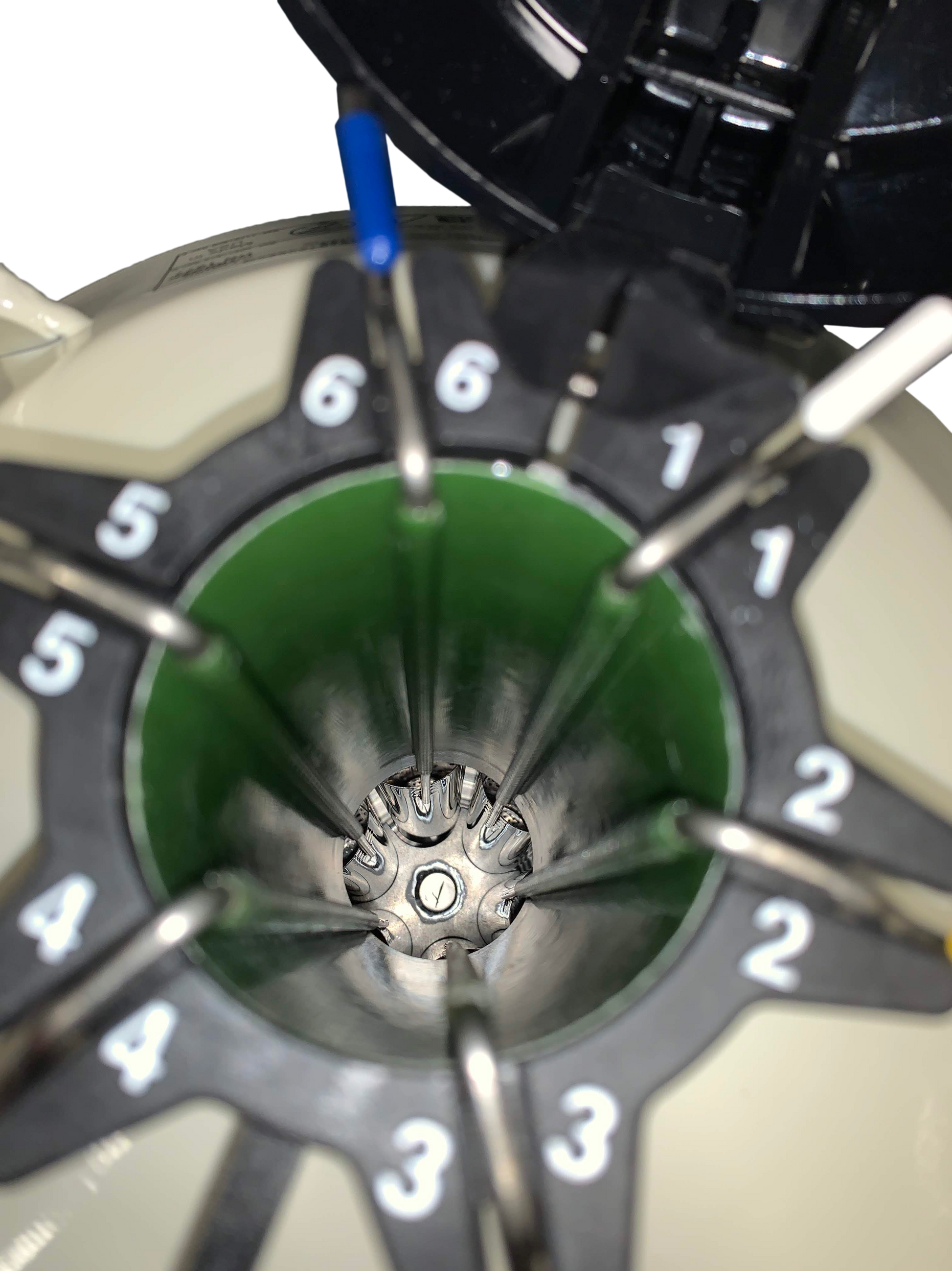 Close-up of a laboratory centrifuge with numbered slots and visible metal rotor, commonly used with the Chart/MVE MVE XC 20 Signature liquid nitrogen tank—the world's best-selling tank, holding 660 straws for up to 20 weeks; 5-year vacuum warranty.