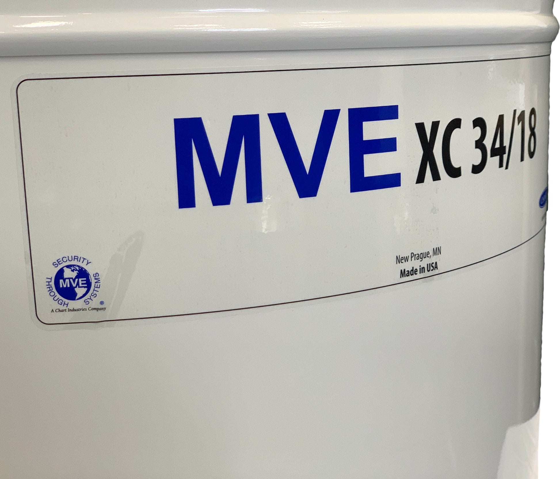 Close-up of a Chart/MVE XC 34/18 storage tank, labeled in blue and black, with security sticker and "Made in USA, New Prague, MN" below. Holds 2100 straws for 18 weeks; includes five-year vacuum warranty.