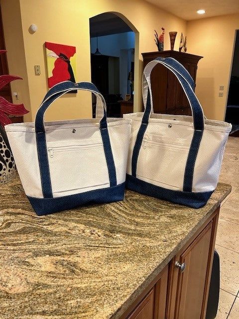 Two Semen Tanks - Select Genetics Totes for Everyday Use with denim accents and 18 or 24 inch straps sit on a granite countertop. Each bag features a front zippered pocket, complementing home decor and wooden cabinets.
