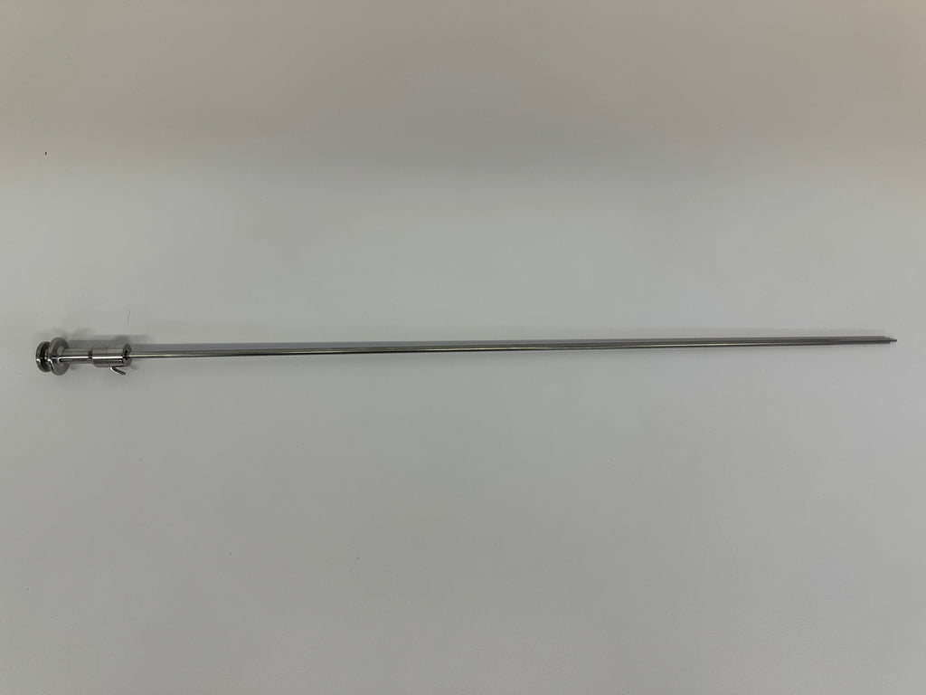 A slender metal rod from the RR AI Kit—With Electric Thaw Unit, featuring a small circular handle and end clip, lies horizontally on a plain, light surface.