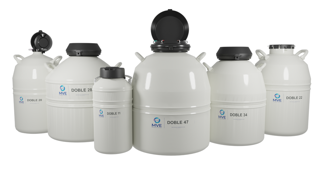 Six white MVE Doble 47-6 cryogenic dewars from Chart/MVE are grouped together, lids open to reveal dark interiors. Each tank holds up to 4,500 straws and features a three-year vacuum warranty—ideal for vapor shipping.