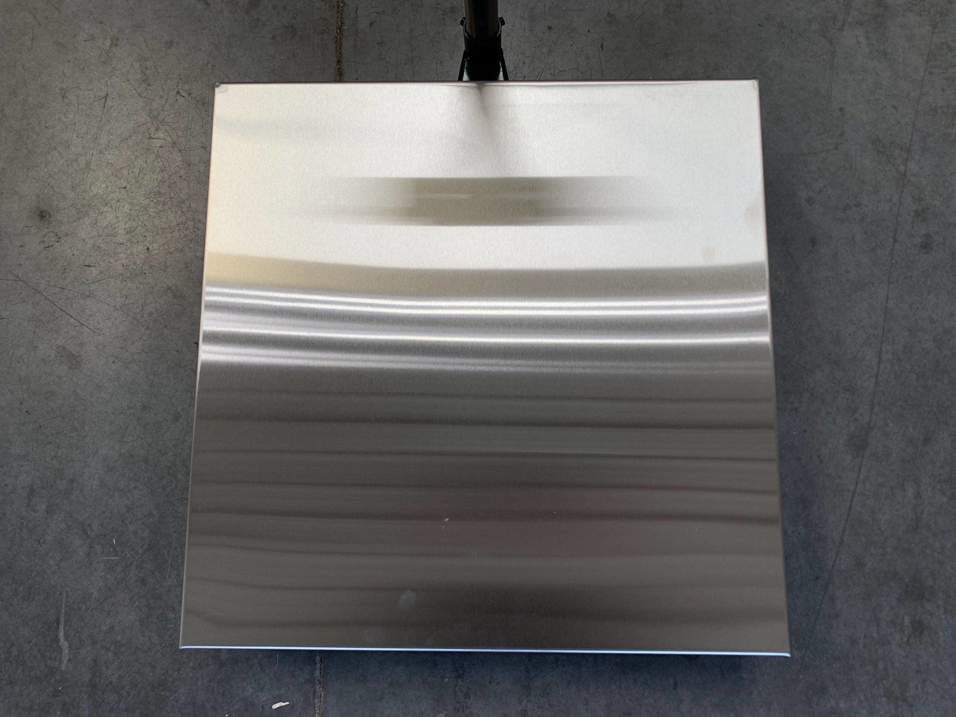 A Semen Tanks - Select Genetics Bench Cryo-Alert Scale 24"x24" (90 lbs, US-6011 Indicator, Stacklight) sits on a gray concrete floor; part of a black scale or tank is visible at the top center.