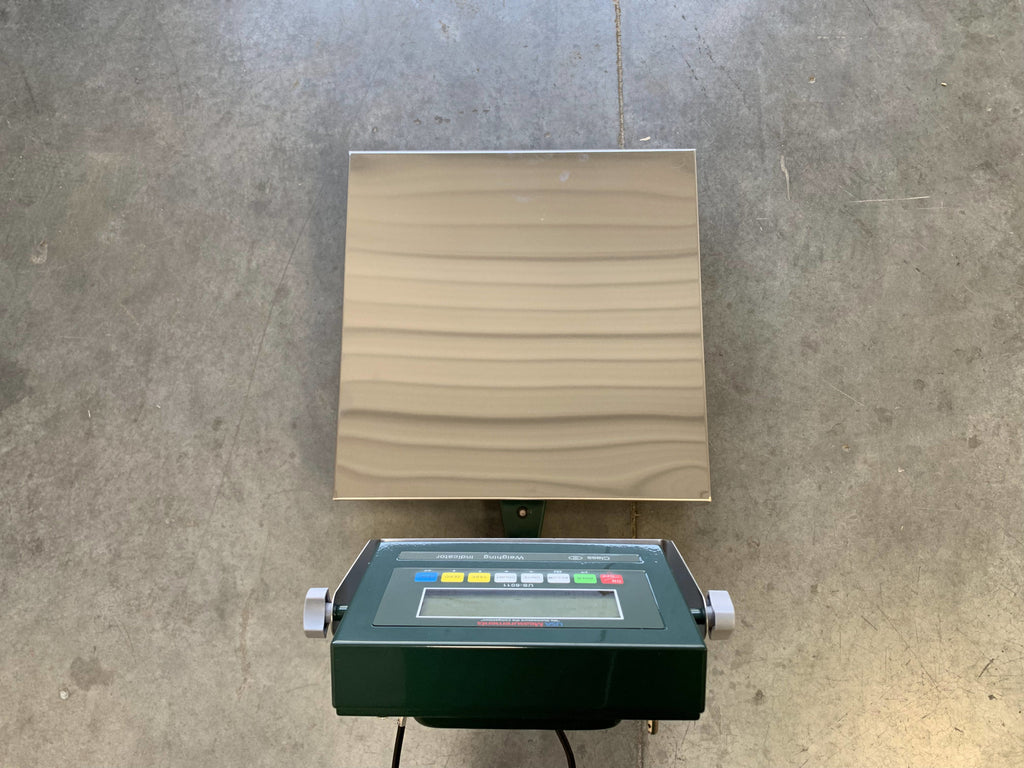 The Semen Tanks - Select Genetics Bench Cryo-Alert Scale 24"x24" (90 lbs) with US-6011 Indicator and stacklight sits on a concrete floor—ideal for semen storage or tank alarm integration.