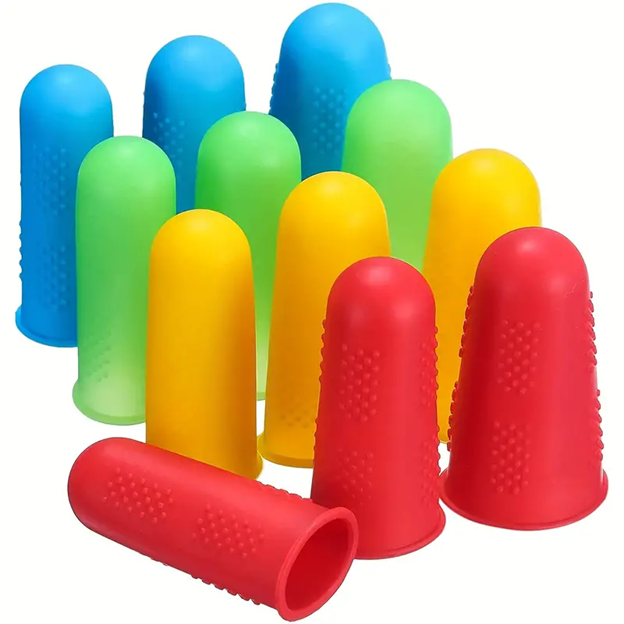 The Semen Tanks - Select Genetics FINGER TIP PROTECTOR features colorful silicone covers in red, yellow, green, and blue with textured surfaces—comfortable to wear and ideal for protecting fingers when handling paper or counting money.