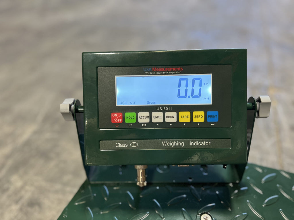 A close-up of the CRYO-ALERT FLOOR SCALE display from Semen Tanks - Select Genetics shows 0.0 lb. The weight indicator, rated for 110 lbs, features buttons including ON/OFF, HOLD, ACCUM, UNITS, COUNT, TARE, ZERO, and PRINT against a blurred background.
