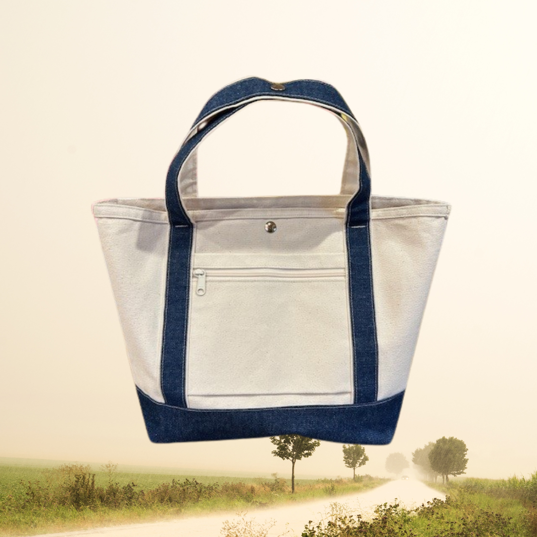 The Semen Tanks - Select Genetics Totes for Everyday Use, featuring denim accents and 18 or 24 inch straps, is shown against a misty countryside road—perfect for pairing with your rolling luggage.