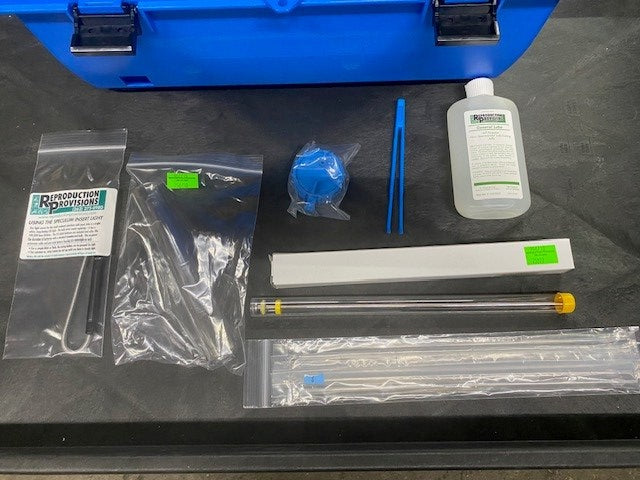 A blue RR Goat AI kit with case and Electric Thaw Unit is shown, including a CITO digital thaw, tweezers, thermometer, straw cutter, Priority Care bottle, LED light, speculum, goat gun, and sheaths.